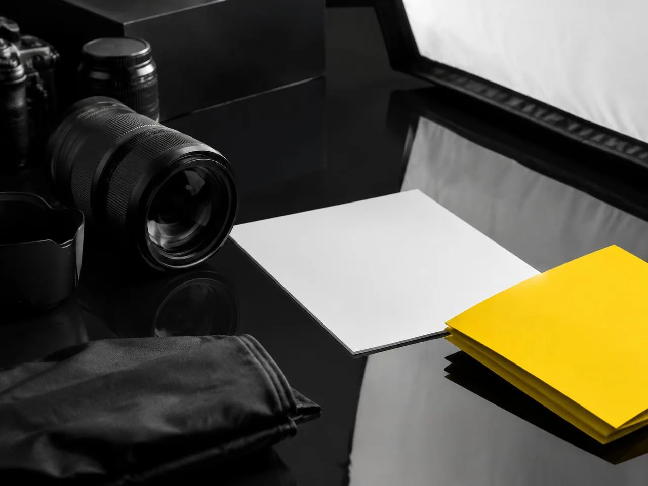 Photography equipment and tactile yellow and white materials in a creative studio.